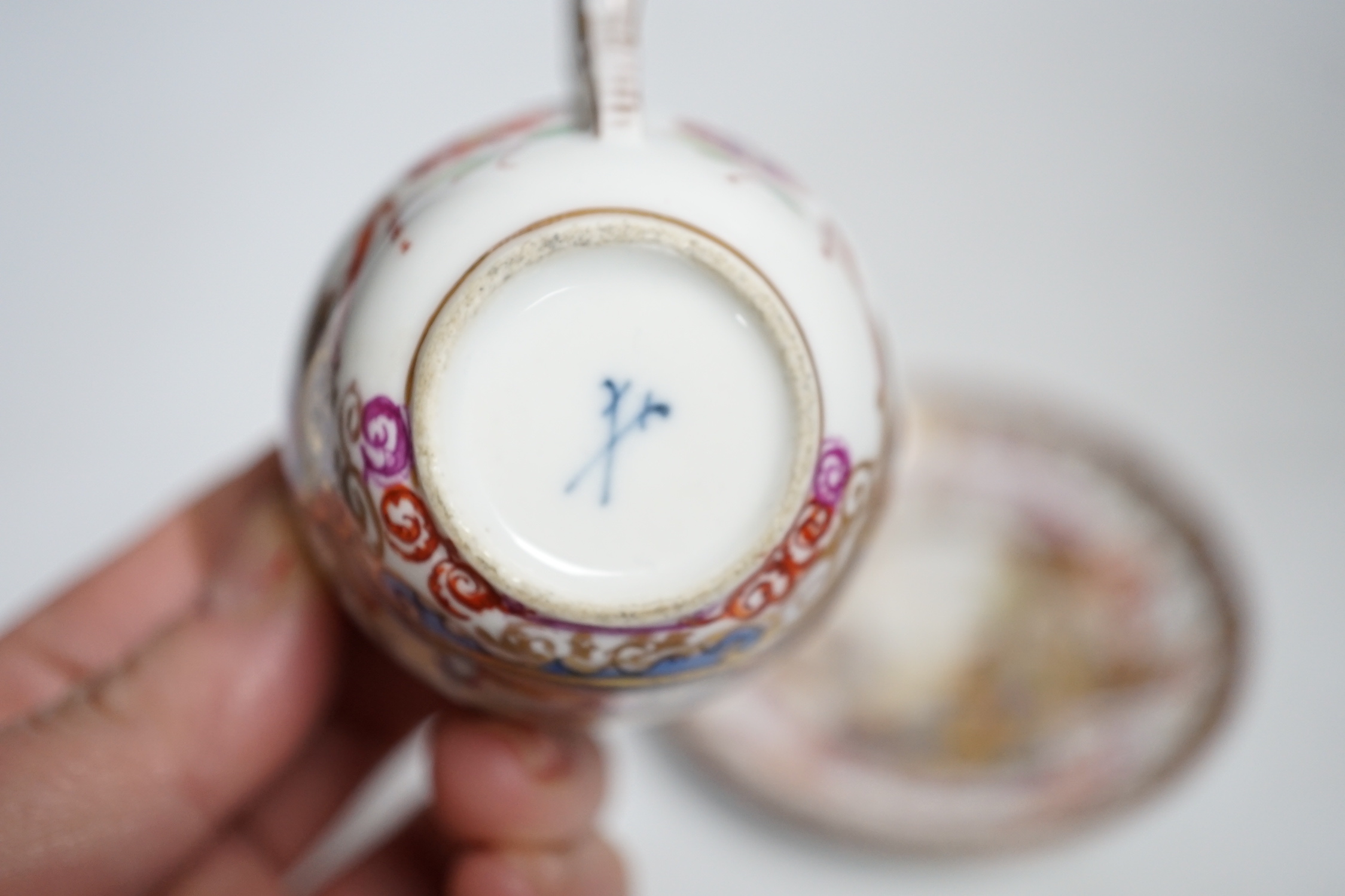 A miniature Dresden teacup and saucer in Meissen-style, cup 4.5cm